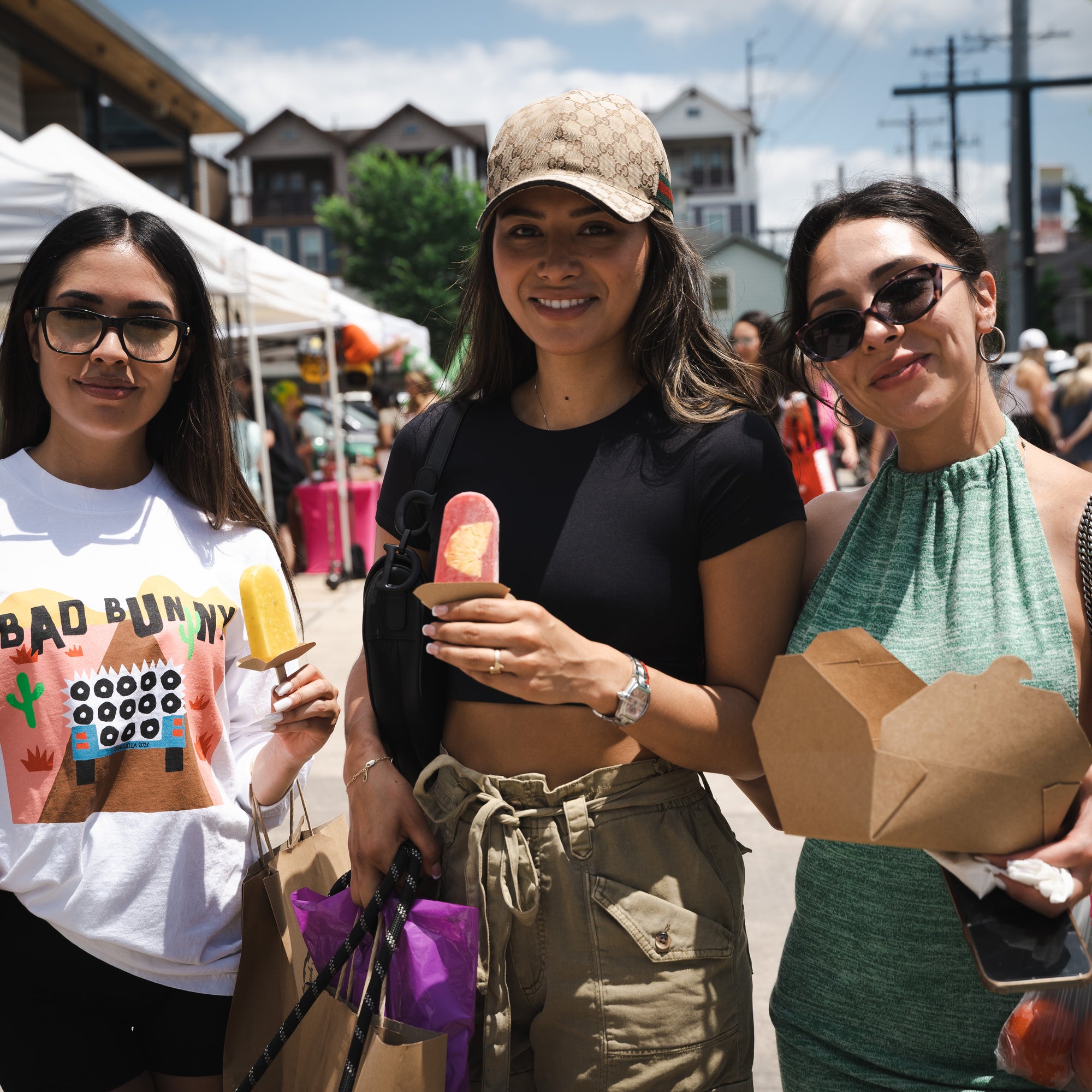 Young Women having all natural popsicles at Farmers Market.